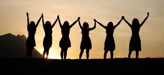 women with hands lifted